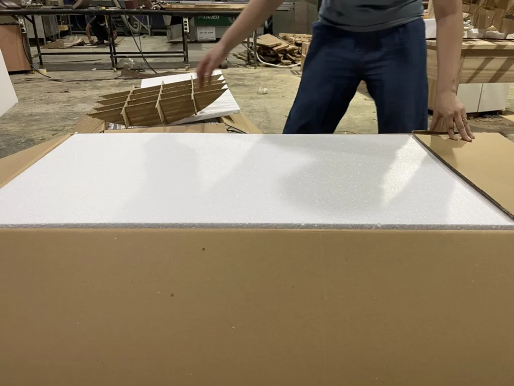 Foam-lined export carton prepared for a furniture sample
