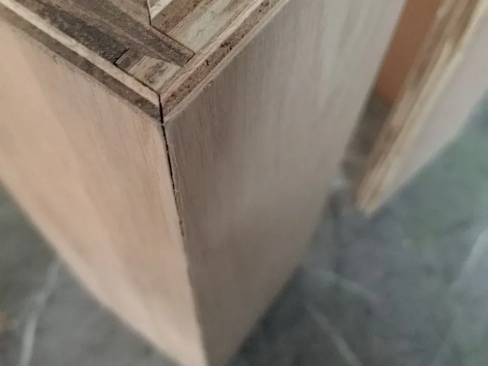 Plywood corner joint with wood veneer checked before finishing